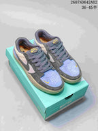 Pair of Nike SB Force 58 low-top shoes in gray, pale neutral, light blue, and yellow on a turquoise box