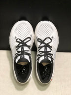 Top-down view showing the perforated forefoot, black laces, padded collars, and tongue branding.