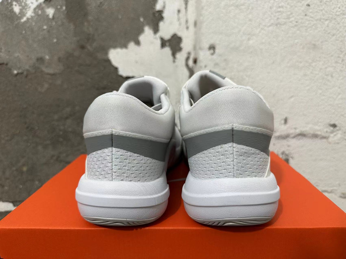 Rear view of white and grey Nike Hyperquick low-top training shoes
