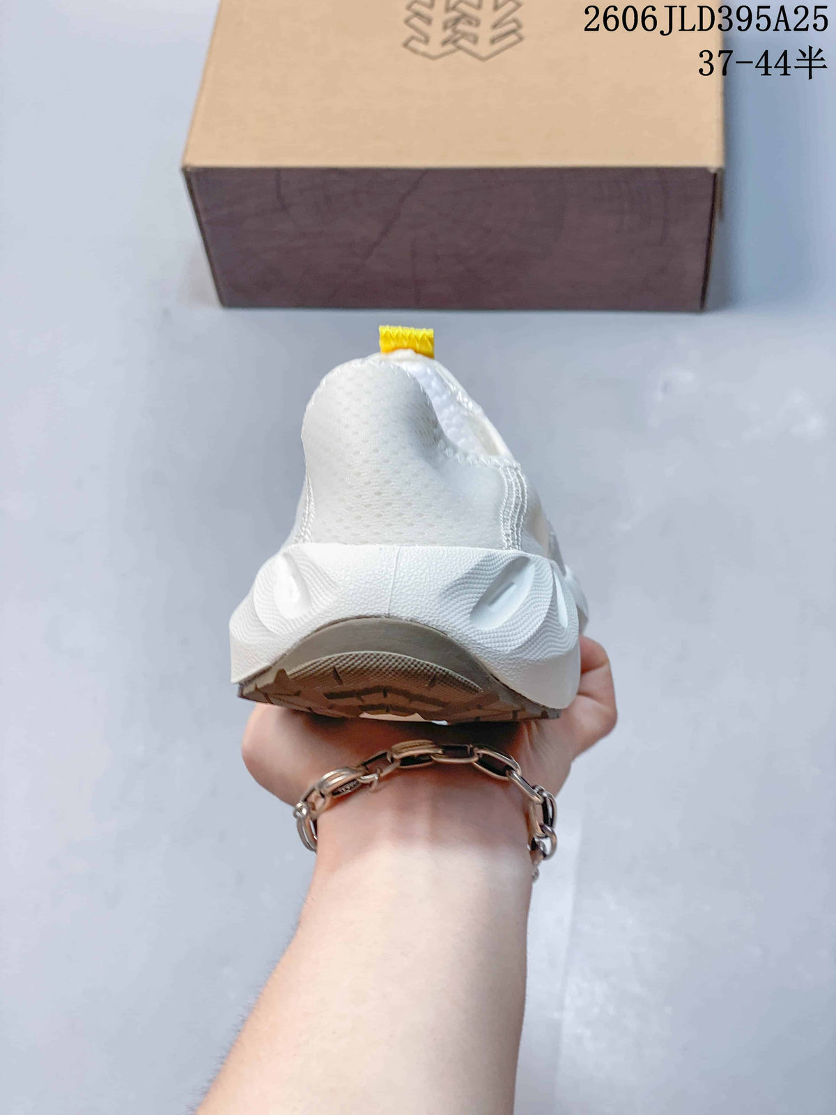 Rear view of the white slip-on shoe showing its heel and sole.