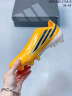 Side profile highlighting the yellow laceless upper, black side stripes, white graphics, and translucent stud outsole.