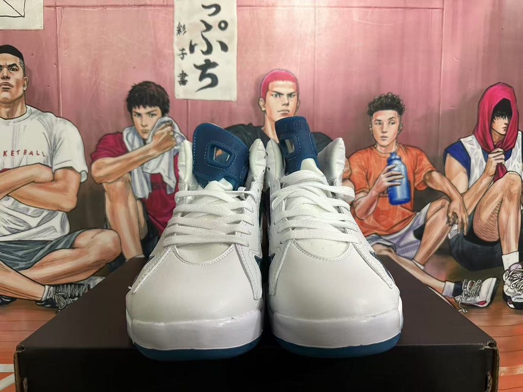 Front view of white and blue high-top sneakers with white laces and blue tongues