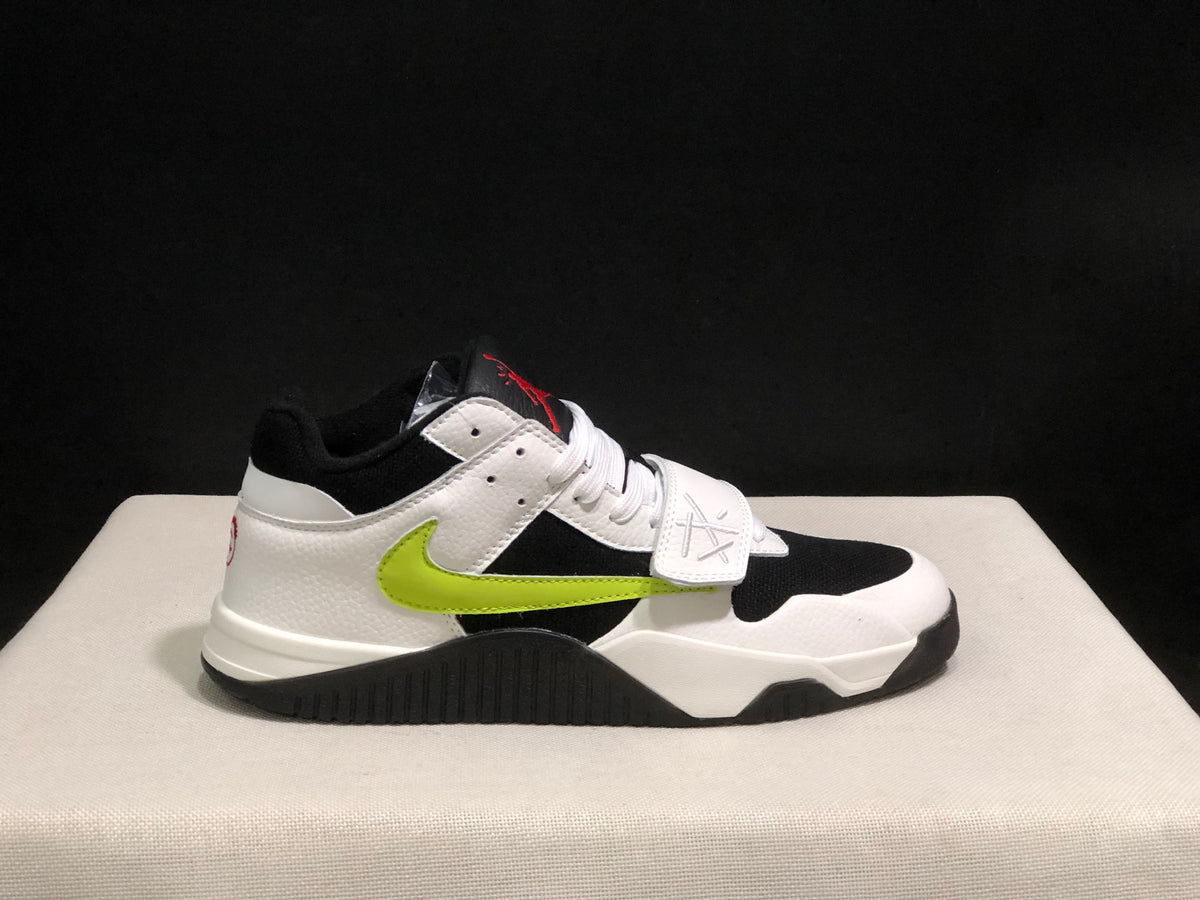 Lateral view highlighting the white heel, black upper panel, fluorescent green side detail, and black outsole.