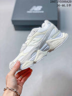 Side profile showing the layered mesh and overlay upper with a sculpted midsole.
