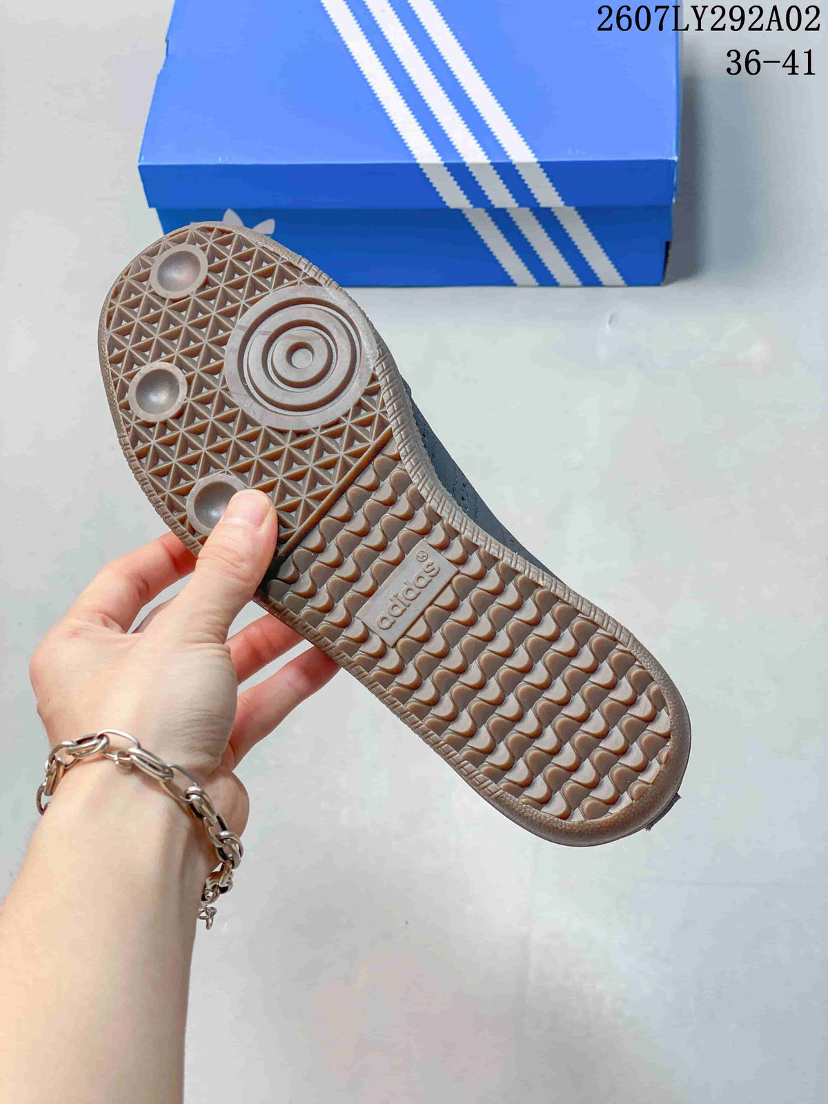 Close view of the textured gum-colored outsole with patterned tread on an Adidas Samba Jane shoe.