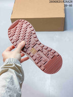 Close-up of the sneaker's dusty-rose patterned outsole.