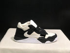 Opposite side profile showing the side branding, midfoot strap, padded collar, and outsole.