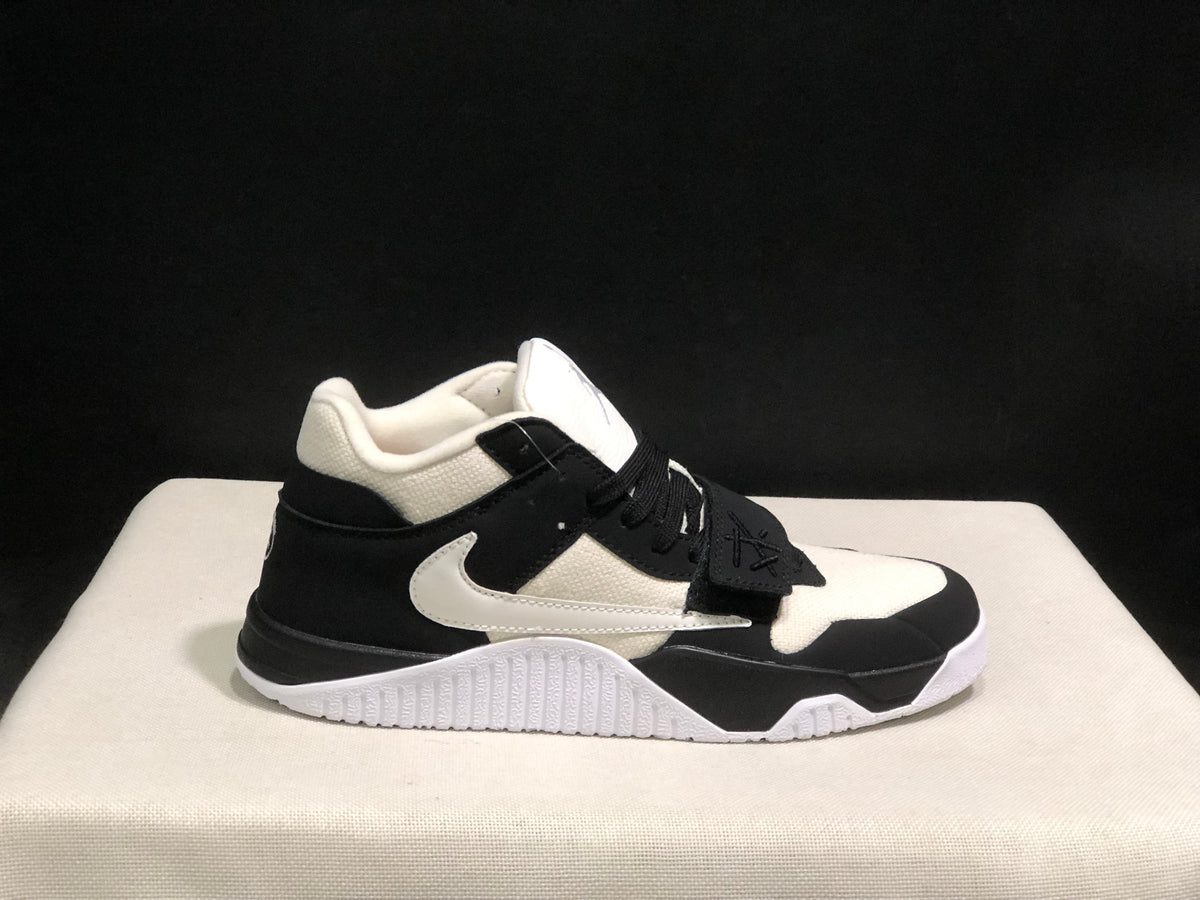 Opposite side profile showing the side branding, midfoot strap, padded collar, and outsole.