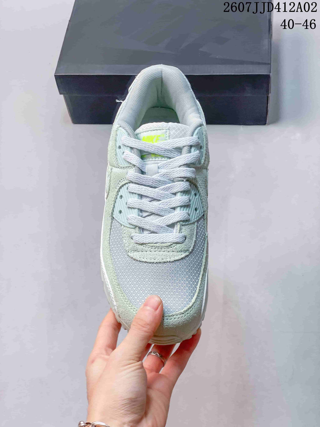 Top view of the sneaker showing the mesh toe, laces, and mint-colored overlays.