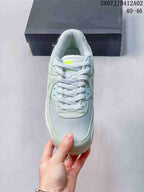 Top view of the sneaker showing the mesh toe, laces, and mint-colored overlays.