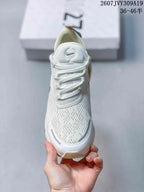 Front view of a Nike Air Max 270 sneaker showing the perforated-looking upper, lace system, padded tongue, and toe design.