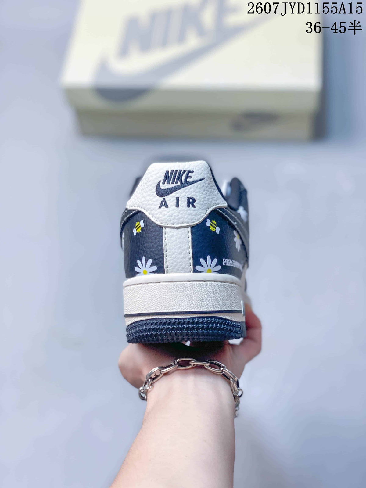 Rear view showing the Nike Air tongue branding, navy floral heel panels, and white midsole.