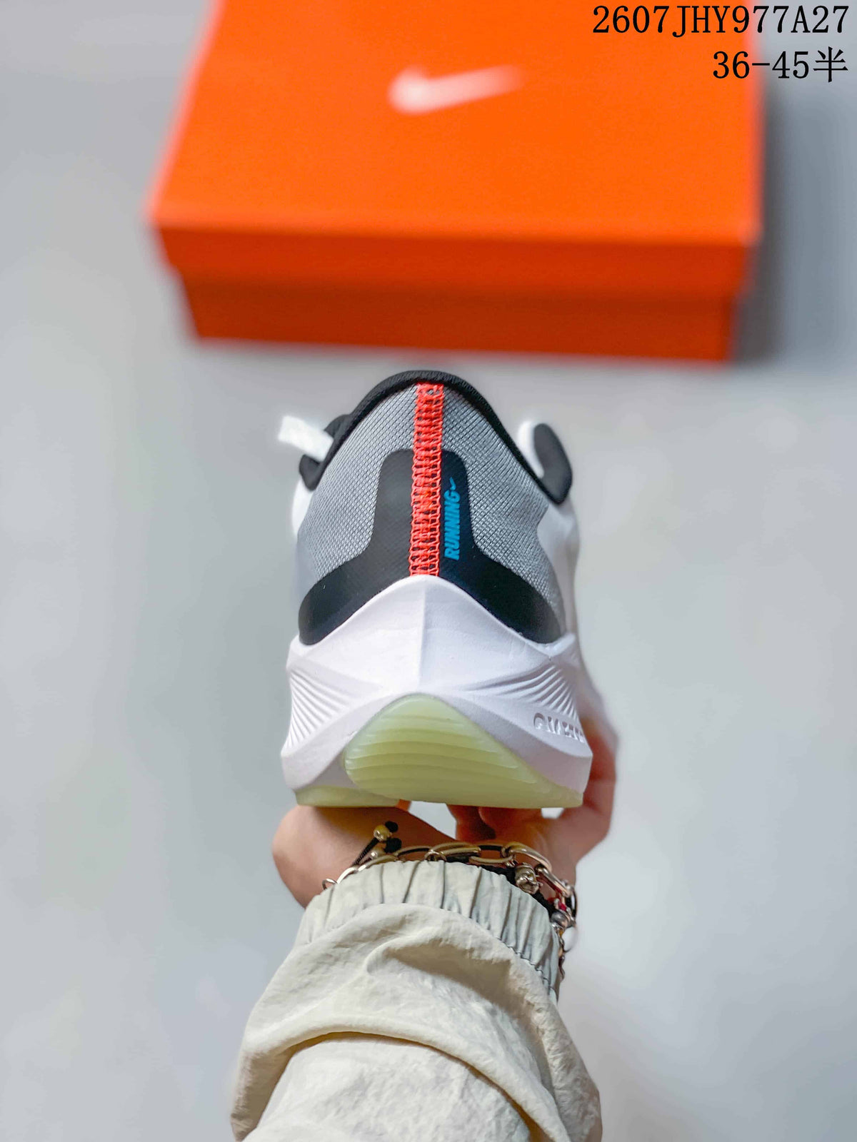 Rear view of the running shoe showing the black and gray heel, red stitching, and white midsole.