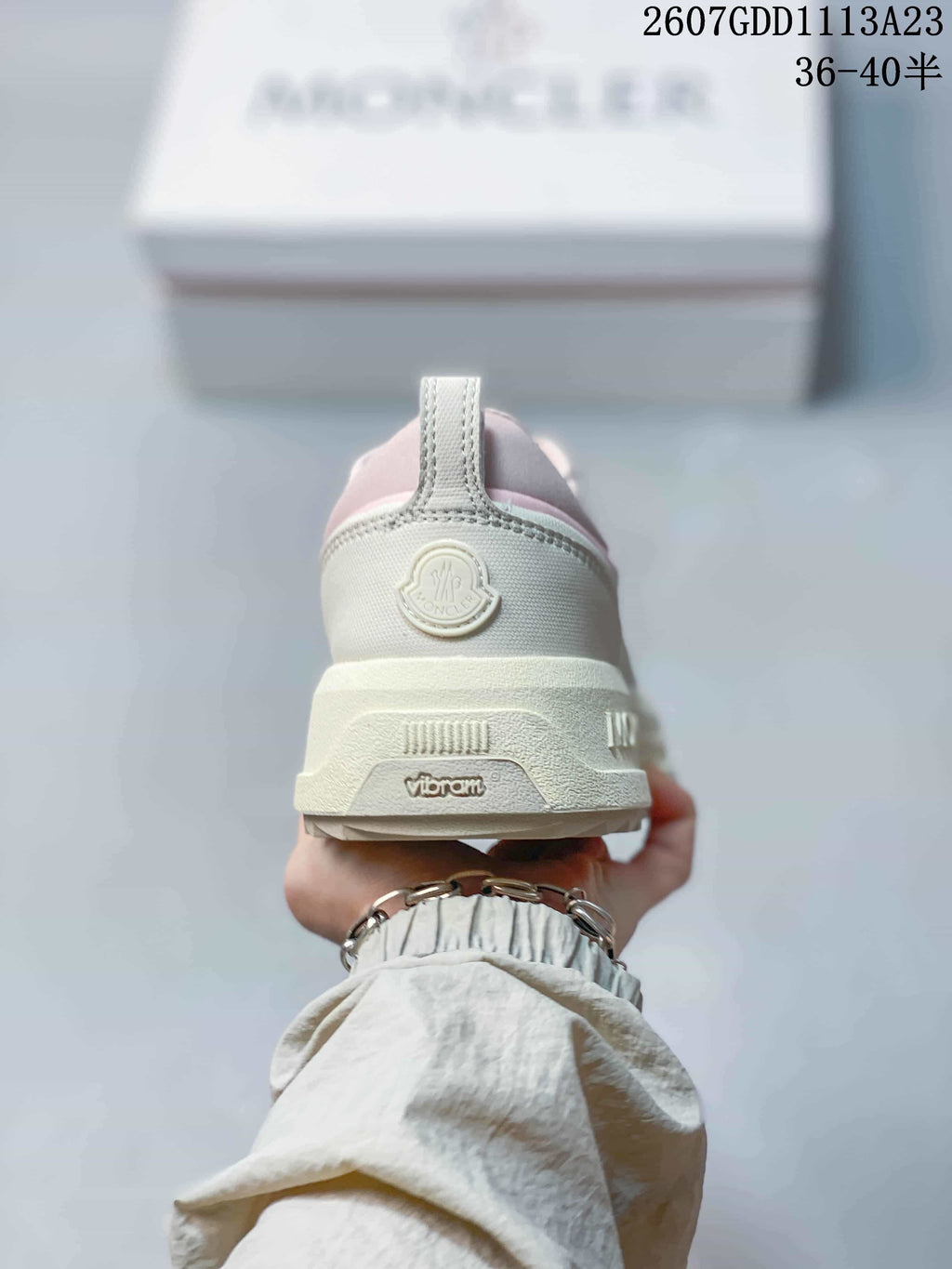Rear view of the sneaker showing the padded heel, Moncler logo detail and layered sole.