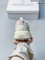 Rear view of the sneaker showing the padded heel, Moncler logo detail and layered sole.