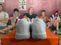 Rear view of white Nike basketball shoes showing perforated heel panels and 101 heel-tab lettering