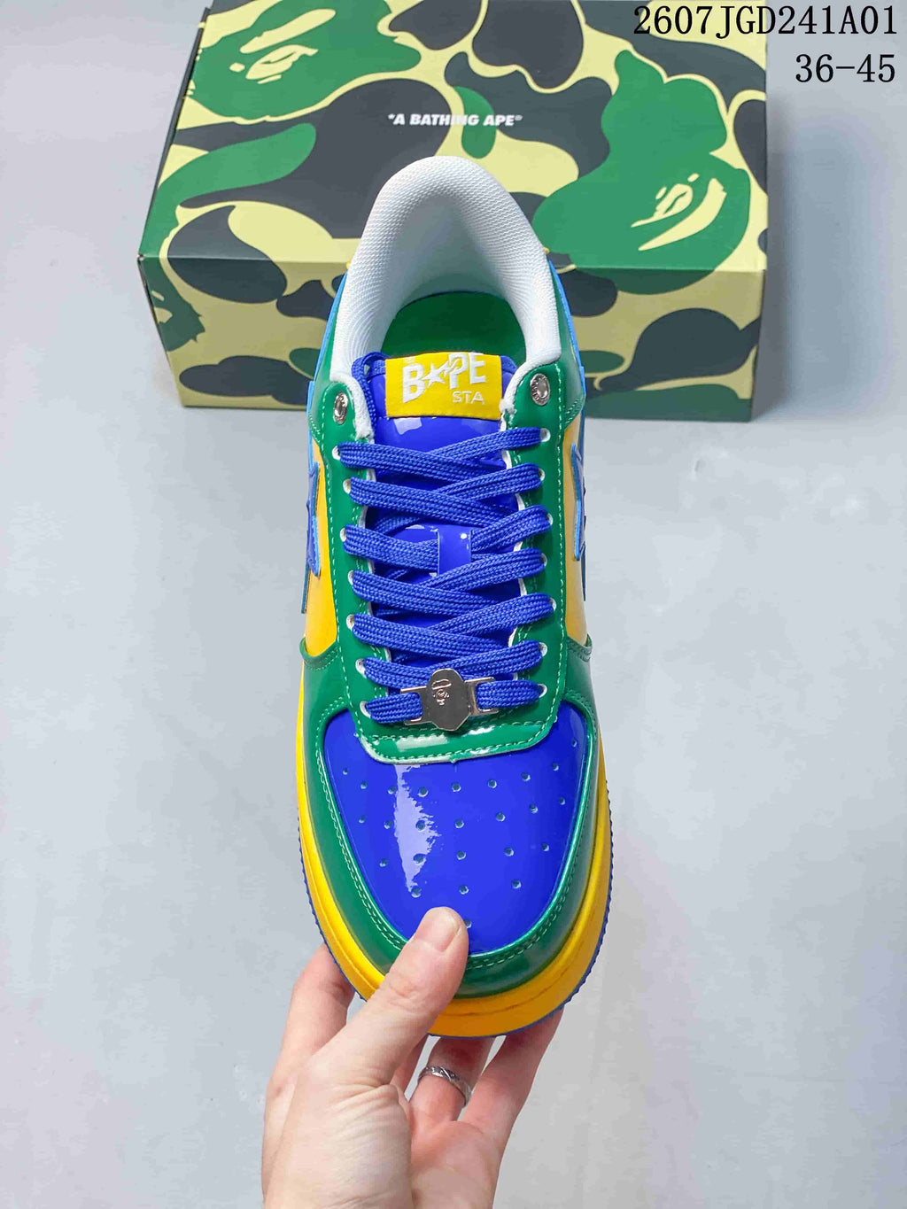 Top view of the sneaker showing blue laces, perforated toe panel, and color blocking