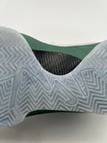 Close-up of the translucent herringbone-pattern outsole and green midsole