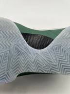 Close-up of the translucent herringbone-pattern outsole and green midsole