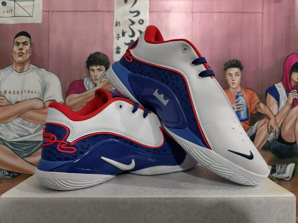 Pair of white, blue, and red Nike basketball shoes shown from the side.