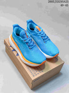 Pair of blue and orange ASICS GEL-NIMBUS 27 running shoes displayed on a shoe box