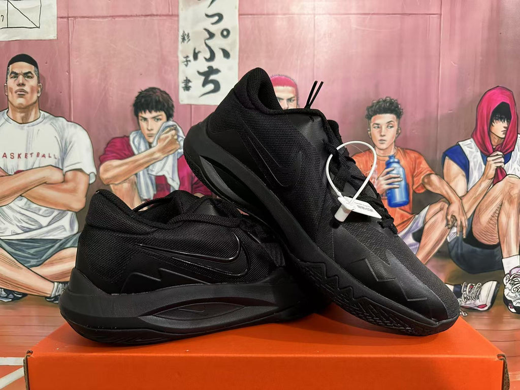 Angled view of black Nike basketball sneakers showing the outsole and side profile