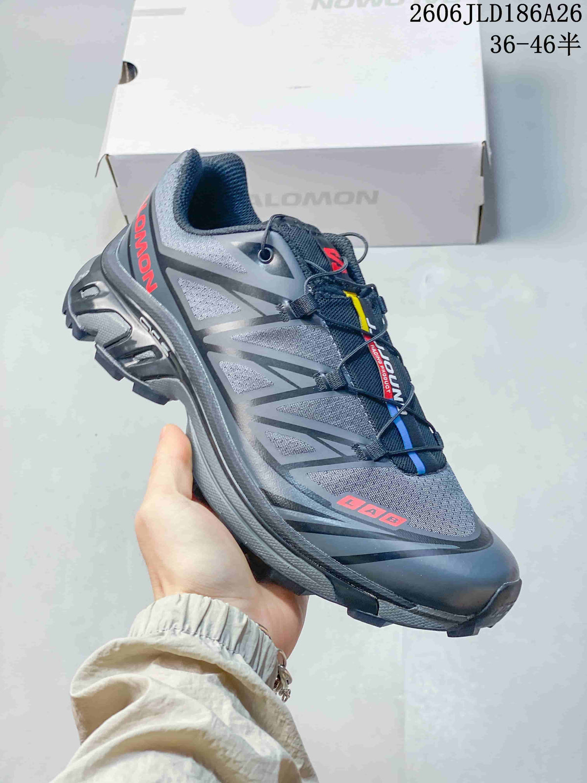 Angled side view of the gray shoe with a patterned upper and lugged sole