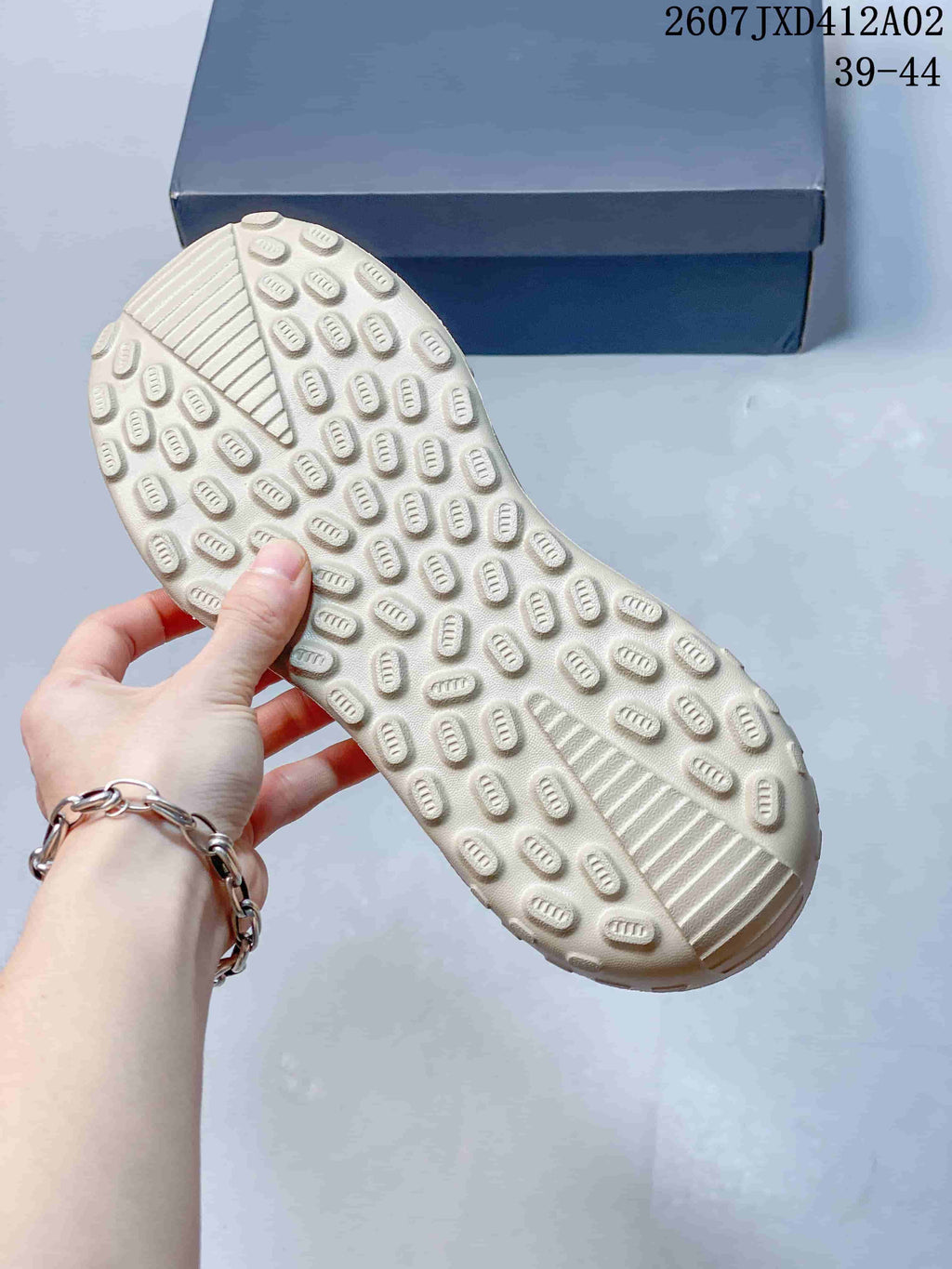 Close-up of the sandal outsole showing its raised tread pattern.