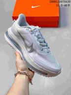 Pale blue-gray Nike Air Zoom Pegasus Premium sneaker with silver side Swoosh and translucent-looking midsole detail.