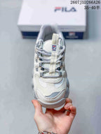 Top view of the sneaker showing the lace-up closure, mesh tongue area, and layered toe design.
