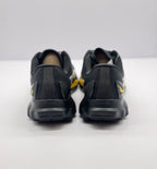 Rear view of the pair showing black heel panels, heel counters and outsole tread edges.