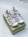 Pair of white and gray KEEN closed-toe outdoor sandals displayed on a branded shoebox; style code JJD267A27 and size range 36–45 are visible.