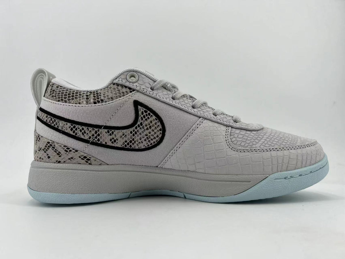 Side profile highlighting the textured panels and contrasting Swoosh
