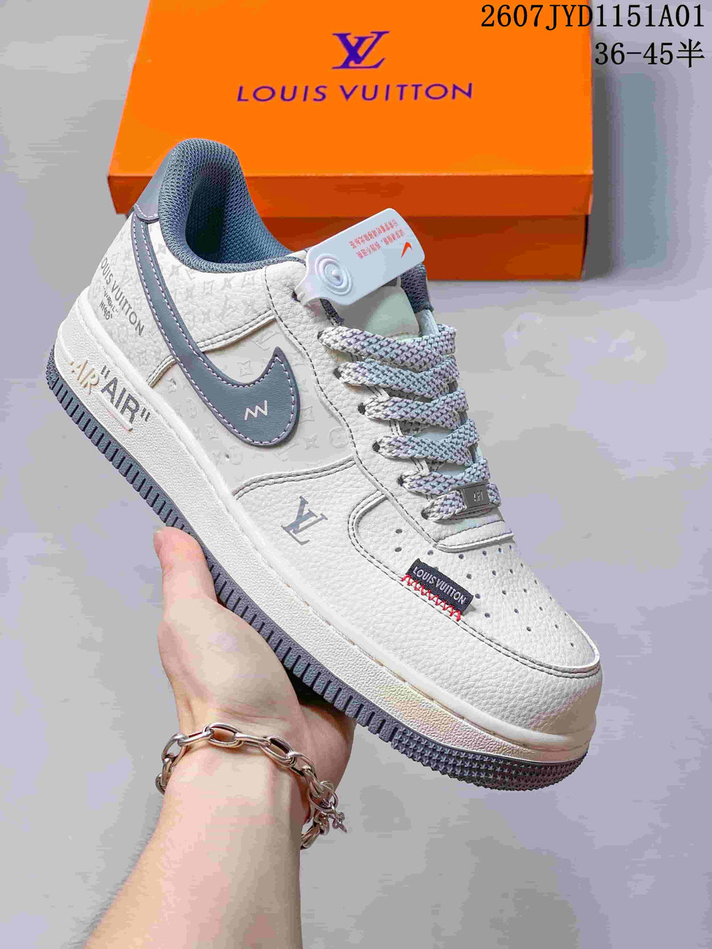 Close-up of a white low-top sneaker with gray side details and AIR midsole