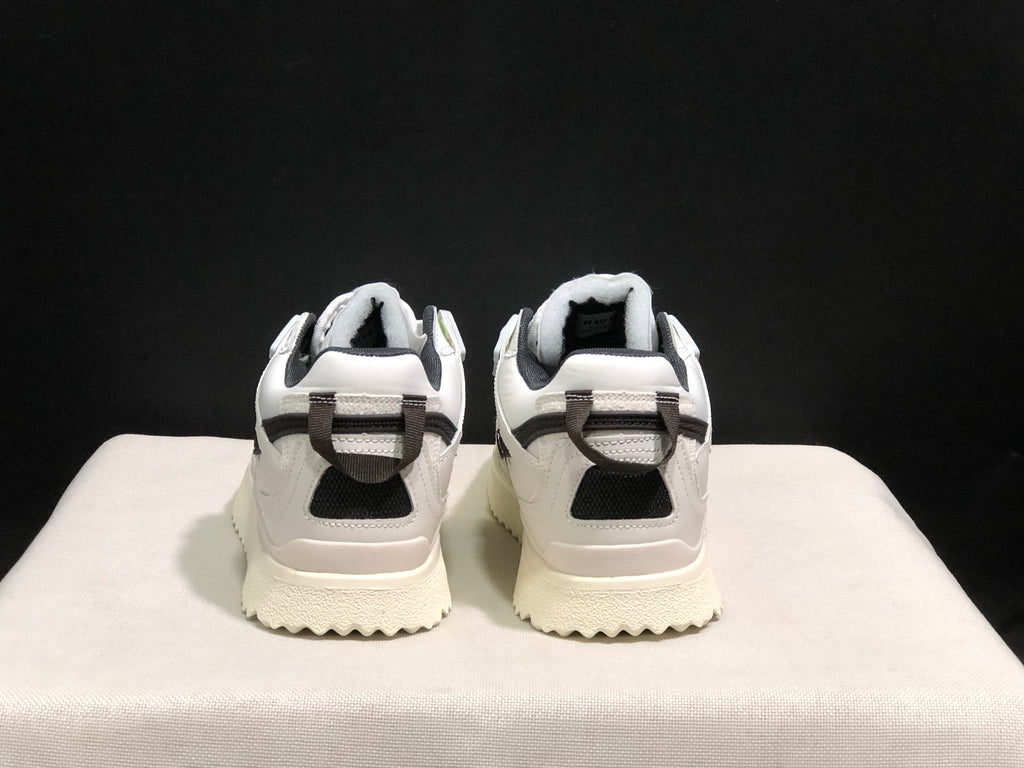 Rear view showing the padded collars, heel pull tabs, dark heel accents, and textured outsoles.