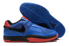 Blue Nike Ja 1 shoes with red and black accents and a blue patterned outsole.