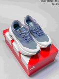 Pair of gray adidas Hyperboost ATR sneakers shown from above on a red box