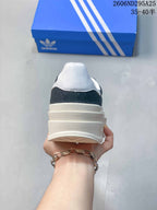 Rear view showing the white padded heel collar and layered off-white platform sole.
