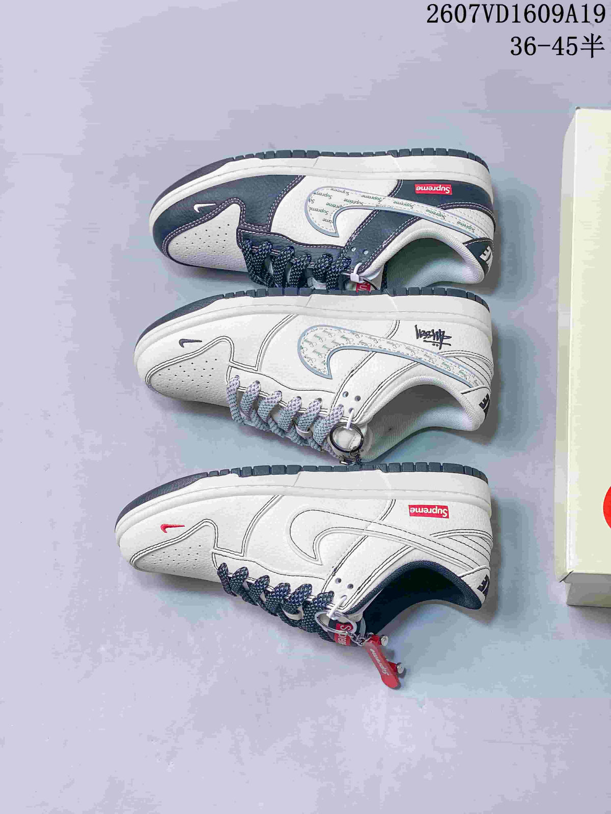 Side-view layout showing three Nike Dunk Low colorway presentations with white uppers, light-grey or navy panels, patterned laces and decorative details.