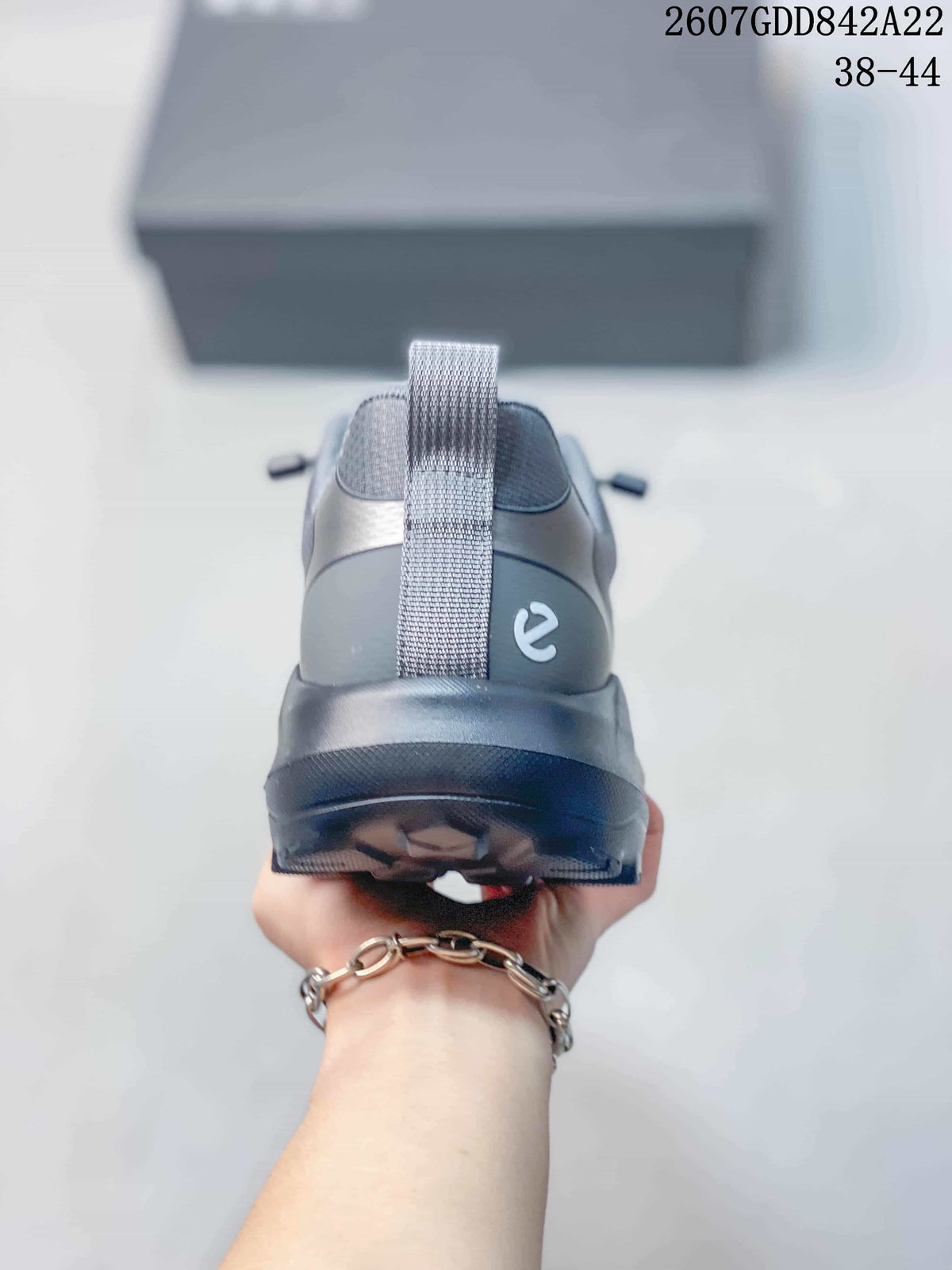 Rear view of the gray ECCO sneaker showing the heel pull tab, padded collar and outsole.