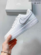 Side profile of a white Nike Air Force 1 '07 low-top sneaker