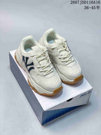 Pair of off-white MLB Bigball Chunky Window sneakers displayed on an MLB shoe box, showing dark side branding and gum-colored outsoles.