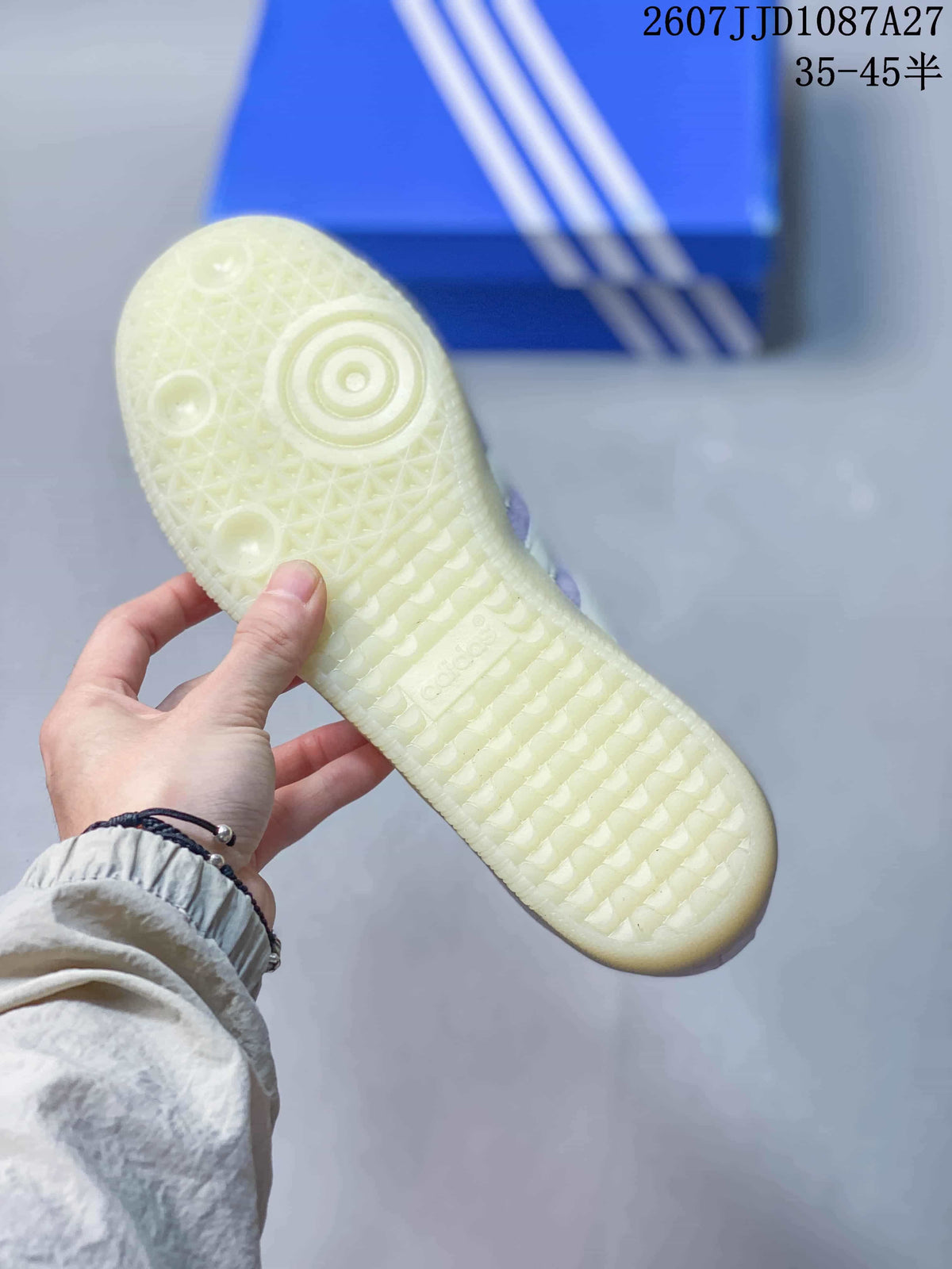 Close-up of the textured translucent rubber outsole with circular and patterned tread details.