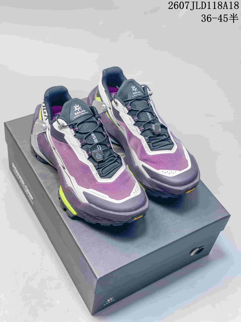 Pair of KAILAS FUGA EX3 BOA hiking shoes in purple, white and lime displayed on a shoebox.