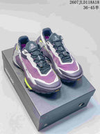 Pair of KAILAS FUGA EX3 BOA hiking shoes in purple, white and lime displayed on a shoebox.