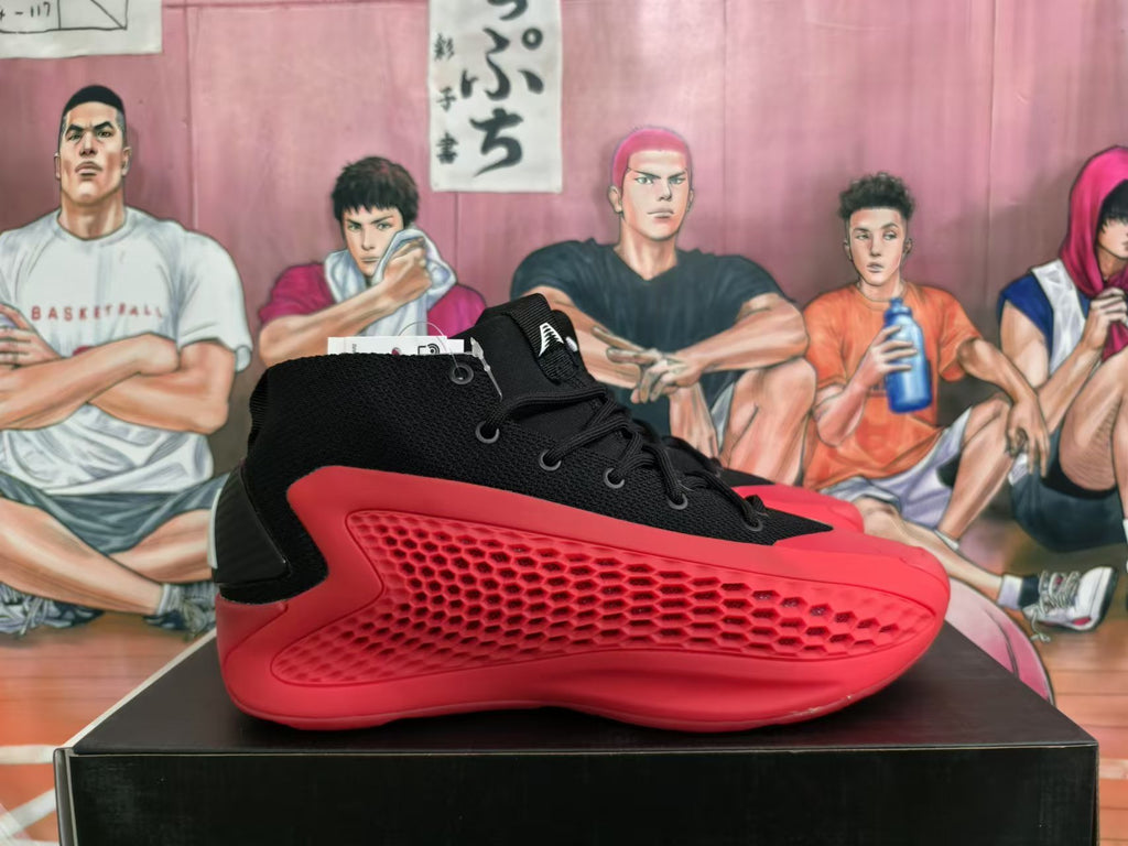 Side view of a black Adidas high-top shoe with red textured panels.