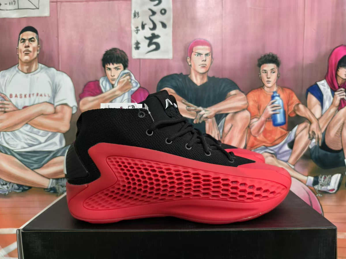 Side view of a black Adidas high-top shoe with red textured panels.