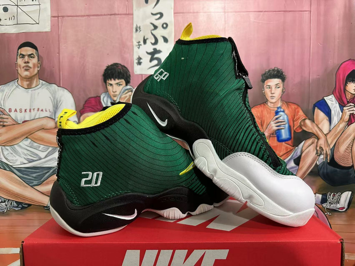 Angled view showing both shoes, the dark green upper, black sole sections, white outsole areas and Nike Swoosh branding.