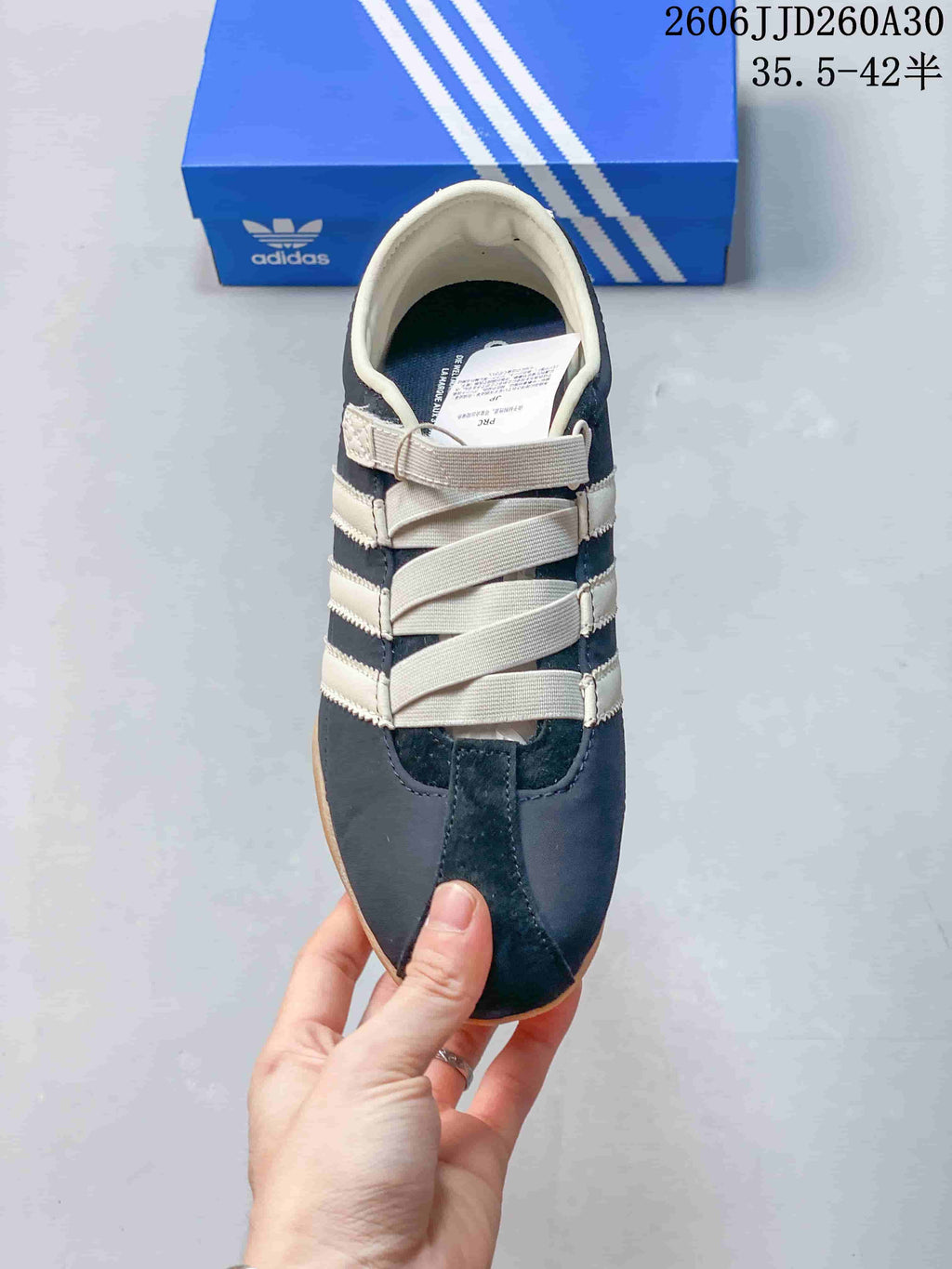 Top view of the sneaker showing elastic cross-over bands
