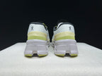 Rear view of the Cloudmonster 2 shoes showing the heel details and lime accents.